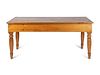 A Continental Provincial Pine Farm Table
Height 32 1/2 x width 72 x depth 27 inches.