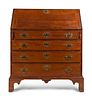 A Chippendale Style Cherrywood Slant-Front Desk
Height 42 1/2 x width 36 3/4 x depth 19 inches.