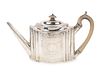 A Regency Silver Teapot
Height 6 1/2 x length 12 x width 4 3/4 inches.