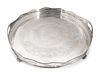 An English Silverplate Two-Handled, Galleried and Footed Circular Tray
Height 3 1/4 inches at handles; diameter 21 3/4 inches.