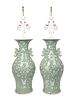 A Pair of Chinese Celadon and White Glazed Baluster Vases Mounted as Lamps
Height of vase 24, overall 38 1/2 inches.