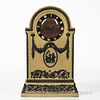 Wedgwood Yellow Jasper Dip Clock Case, England, c. 1930, applied black relief with classical medallion beneath floral festoons terminat