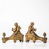 Pair of French Bronze Chenets with Brass Tools, 19th century, each chenet with seated putti blowing a cornucopia-shaped horn and set at