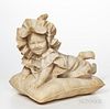Alabaster Figure of an Infant, 19th/20th century, sculpted playfully laying on a pillow, faint inscription beneath the edge of the pill