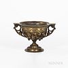 Empire-style Bronze Footed Compote, 19th century, scrolled handles to a bowl adorned with flowers in high relief and set atop a foliate