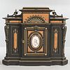 Victorian Ebonized Cabinet, late 19th/early 20th century, with Eastlake-style incised and gilded linear motifs and burlwood panels cent