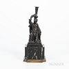 Wedgwood Black Basalt Diana Candleholder, England, 19th century, the figure seated atop a stepped octagonal base and modeled holding a
