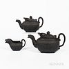 Three Black Basalt Wellington Commemorative Tea Wares, England, c. 1820, lion head spouts and swan handles, figural relief to one side