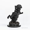 Wedgwood Black Basalt Bacchanalian Boy, England, early 19th century, the standing figure modeled holding a log in one hand, a club in t