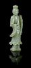 * A Celadon Jade Figure of Guanyin POSSIBLY 19TH CENTURY Height 9 inches.