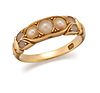 AN 18 CARAT GOLD AND PEARL RING, stamped '18', set with thr