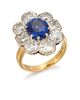 AN 18 CARAT GOLD SAPPHIRE AND DIAMOND CLUSTER RING, the ova