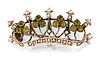 A PERIDOT AND SEED PEARL CROWN BROOCH, set with trefoils of