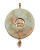 A CHINESE JADE AND GOLD BI STYLE PENDANT, the round jade pe