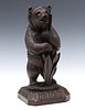 AN EARLY 20TH CENTURY BLACK FOREST CARVED BEAR FIGURE