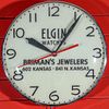 A LIGHTED ELECTRIC CLOCK ADVERTISING ELGIN WATCHES