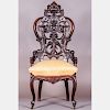 A Victorian Carved Hardwood Chair in the Style of J. & J.W. Meeks, Baltimore, 19th Century.