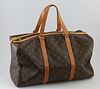 Louis Vuitton Brown Monogram Coated Canvas 45 Sac Souple Travel Bag, the vachetta leather strips and handles with yellow stitching, ...