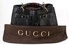 Gucci Black Small Grained Leather Bamboo Tote, the bamboo handles with golden brass hardware, the front exterior with an open pocket...