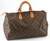 Louis Vuitton Brown Monogram Coated Canvas 40 Speedy Handbag, with golden brass hardware and vachetta leather handles, opening to a ...