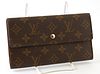 Louis Vuitton International Wallet, the brown monogram coated canvas with golden brass accent snap, opening to one card holder compa...