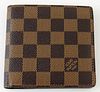 Louis Vuitton Brown Marco Wallet, the coated damier ebene canvas, opening to two bill compartments, one card holder, and a coin pouc...