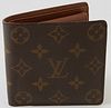 Louis Vuitton Marco Wallet, the brown coated monogram canvas, opening to three bill compartments, one card holder and one coin pouch...