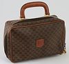 Celine Brown Macadam Coated Canvas Toiletry Bag, the exterior with a brown leather Celine emblem, a brown leather handle with golden...