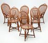 Four Cane-Wrapped Bent Wicker Chairs and a Pair of Matching Armchairs
