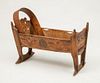 Continental Carved and Stained Rocking Cradle