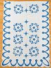 Pair of blue and white rose wreath quilts