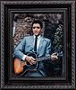 Autographed Photo of Elvis Presley, signed faintly in blue ball-point pen on the guitar.