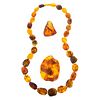 A Graduated Amber Necklace & Two Amber Pendants