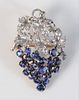 18 Karat White and Yellow Gold Brooch
bunch of grapes with diamonds in the leaves, and blue sapphires as grapes
height 1 1/2 inches
8.8 grams