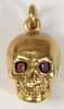 18 Karat Gold Skull Container with Red Stone Eyes
height 1 inch
9 grams
