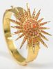 22 Karat Gold Bangle Style Bracelet
set with large star, set with coral, and red stones, one stone missing
50.7 grams