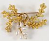 18 Karat Gold Brooch
set with five pearls and one diamond
signed 'L.J.'
length 1 3/4 inches
12.9 grams