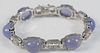 18 Karat White Gold Bracelet 
set with six cabochon cut chalcedony, mounted with diamonds
signed M.C.D.
length 7 inches