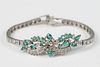 14 Karat White Gold Bracelet
set with emeralds, and diamonds
length 7 inches
15.8 grams
