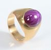 18 Karat Gold Ring
set with cabochon cut pink sapphire
size 8 1/4
11.3 x 13.2 millimeters
19.2 grams