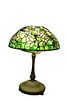 Tiffany Studios Apple Blossom Leaded Glass Table Lampshade having rare raised branches, flowers with pink petals, and yellow centerheight 21 1/2 inc