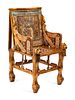 An Egyptian Style Parcel Gilt and Inlaid Throne Chair