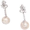 PAIR OF EARRINGS WITH HALF PEARLS AND DIAMONDS IN PALLADIUM SILVER Weight: 11.6 g.