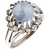 RING WITH STAR SAPPHIRE AND DIAMONDS IN 10K WHITE GOLD Weight: 6.9 g. Size: 6 1 Cabochon cut star sapphire: 9 ...