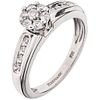 RING WITH DIAMONDS IN 14K WHITE GOLD Weight: 4.2 g. Size: 6 ¾ 15 Brilliant cut diamonds ~ 0.30 ct
