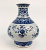 CHINESE QING STYLE BLUE AND WHITE FLORAL VASE