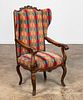 FRENCH PROVINCIAL WOOD & UPHOLSTERED WING ARMCHAIR