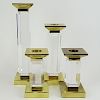 Charles Hollis Jones Four (4) Piece Suite of Pedestal Style, Beveled Lucite and Brass Candlesticks.