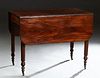 American Carved Mahogany Drop Leaf Dining Table, 19th c., the rounded edge top on turned tapered reeded legs with casters, H.- 29 3/4 in., W.- Closed-