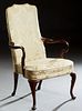 English George III Style Carved Mahogany Armchair, early 20th c., the canted arched cushioned back over two curved arms, to a bowed cushion seat, on c